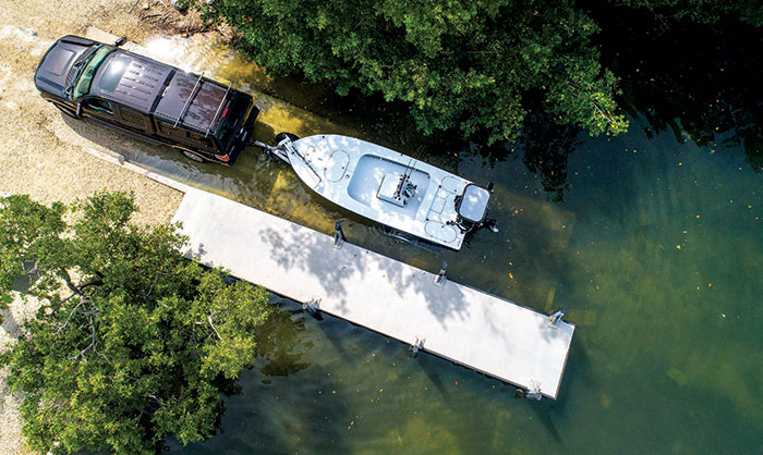 Tow Vehicle with Boat on Trailer Near Launch
