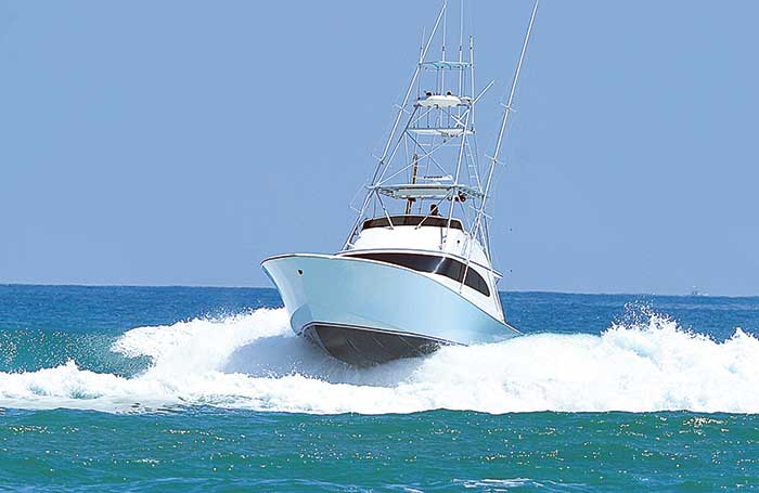 48-foot sportfish breaking wave