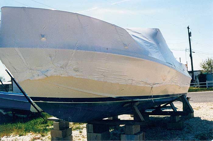 Shrinkwrapped boat on blocks