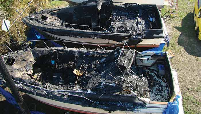 Smoldering shrinkwrapped boats