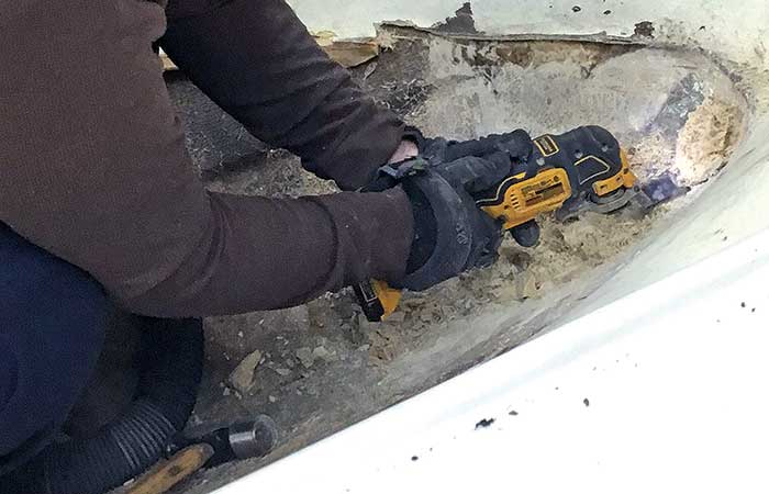 Sanding deck after old stringers removed