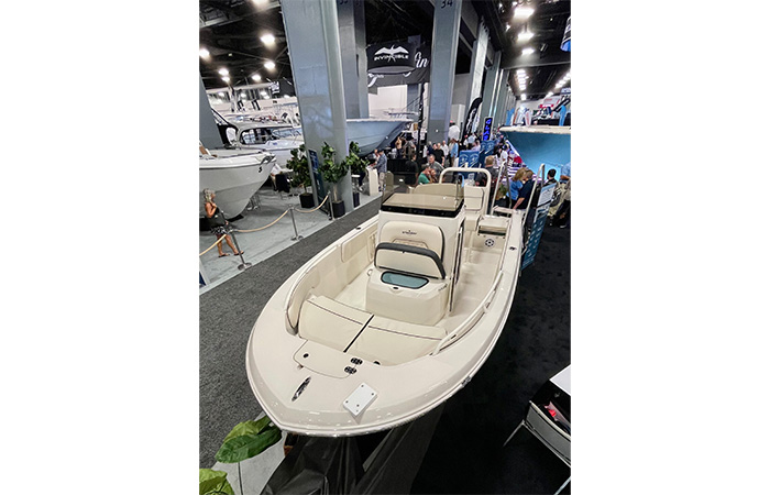 White vessel on the showroom floor being checked out by potential customers.