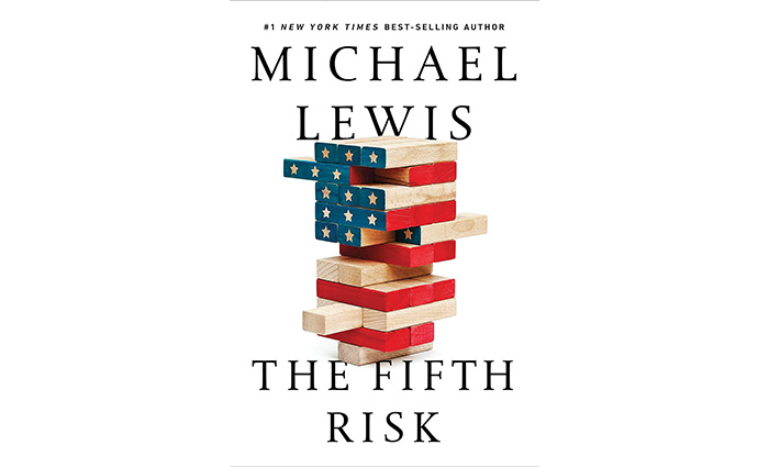 Michael Lewis' The Fifth Risk book cover featuring stacked blocks reflecting the American Flag.