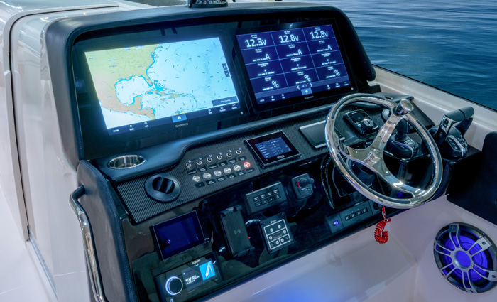 Vessel steering and GPS navigation system on a black counsel. 