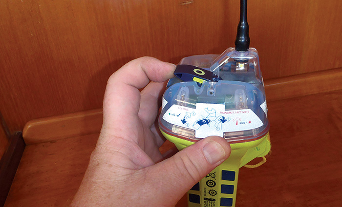 Adult male hand holding a yellow and black handheld bacon.