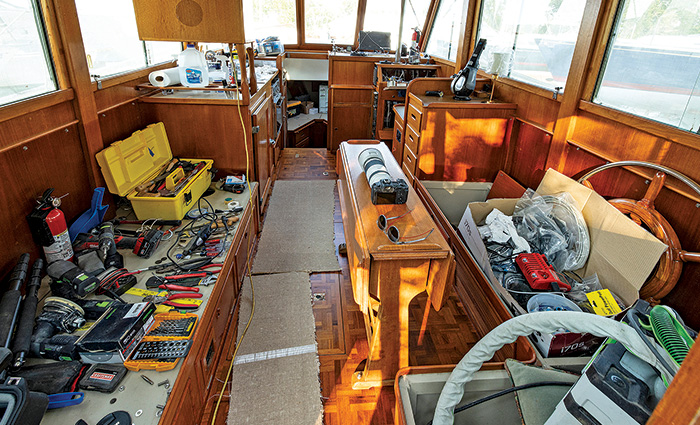 Various tools organized and spread throughout  the main saloon of a vessel.