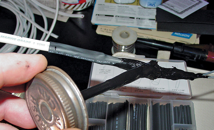 Liquid electrical tape being applied to create airtight, waterproof seals and reduce corrosion.