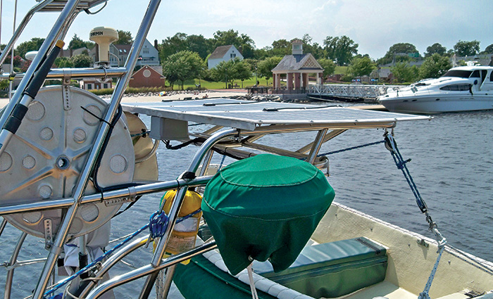 Solar panel in use on top of a vessel in open waters during sunlight.