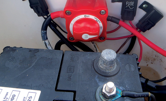 Black battery with a red on/off switch.