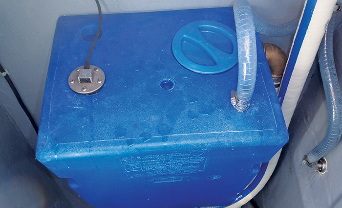 Overhead view of a large blue holding tank.