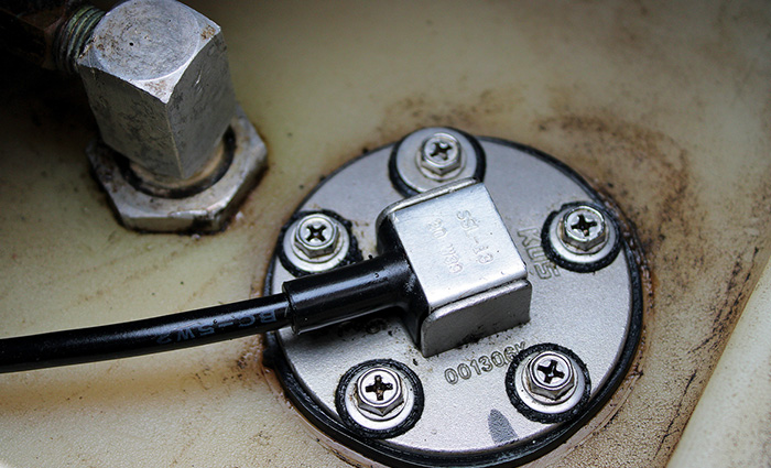 Up-close view of a silver fuel cap.